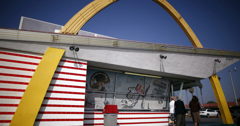 Many fast food chains are now shaped like boxes, decorated with fake wooden paneling, imitation stone or brick exteriors, and flat roofs